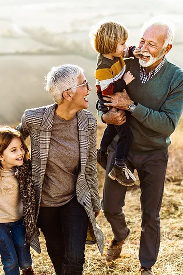 Smiling seniors with grand-children