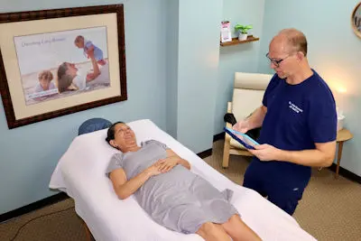 John and patient lying down